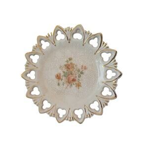 Vintage round plate with shamrock shaped holes around the edge!